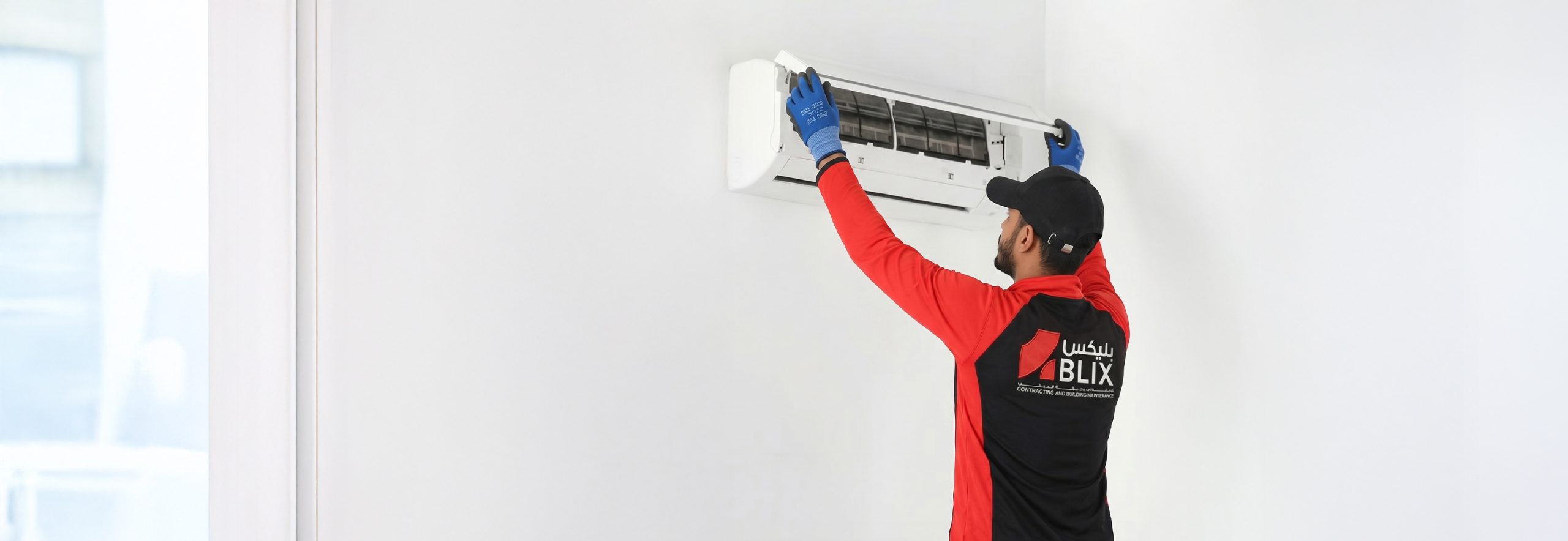 HVAC installation technician working on AC unit | فني تكييف وتبريد يقوم بتركيب وحدة تكييف